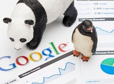 Plastic toys of a panda and penguin representing designated changes in Google's algorithm named according to the animals