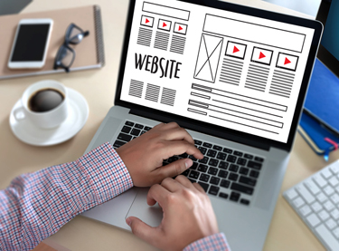 A web designer working on a website design Tampa FL businesses want to help drive leads and meet internet marketing strategy goals